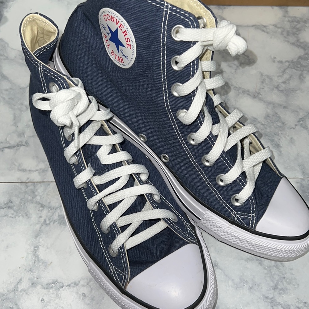 New Navy blue high top converse .